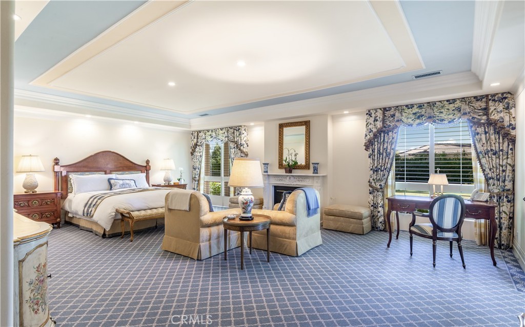 34 Crest Rolling Hills Palos Verdes Peninsula, CA 90274 - Photo 16 of 35 a bedroom with furniture and a fireplace