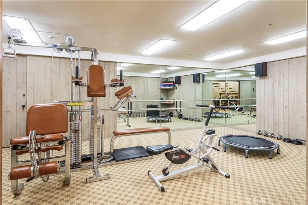 34 Crest Rolling Hills Palos Verdes Peninsula, CA 90274 - Photo 25 of 35 a room with gym equipment and a view of living room