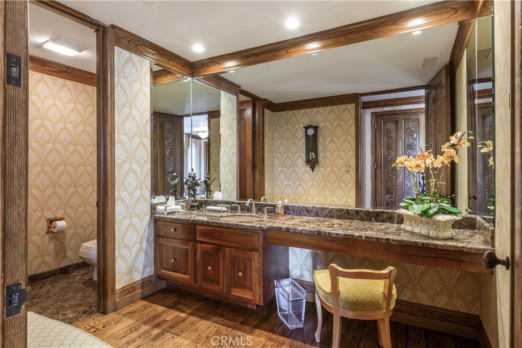 34 Crest Rolling Hills Palos Verdes Peninsula, CA 90274 - Photo 27 of 35 a bathroom with a granite countertop sink a mirror and a shower