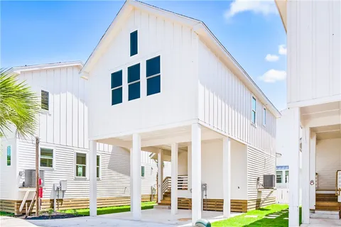 a front view of a building with a swimming pool
