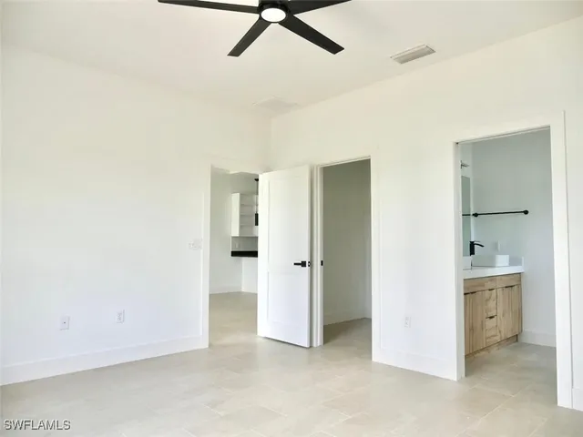 a view of a kitchen with a sink and dishwasher
