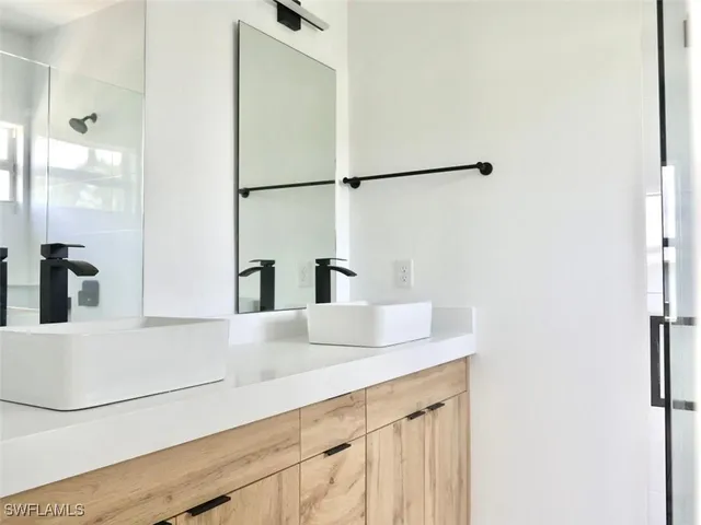 a close view of a sink and a refrigerator in a kitchen