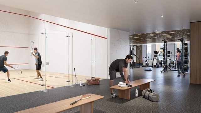 a living room with furniture and gym equipment
