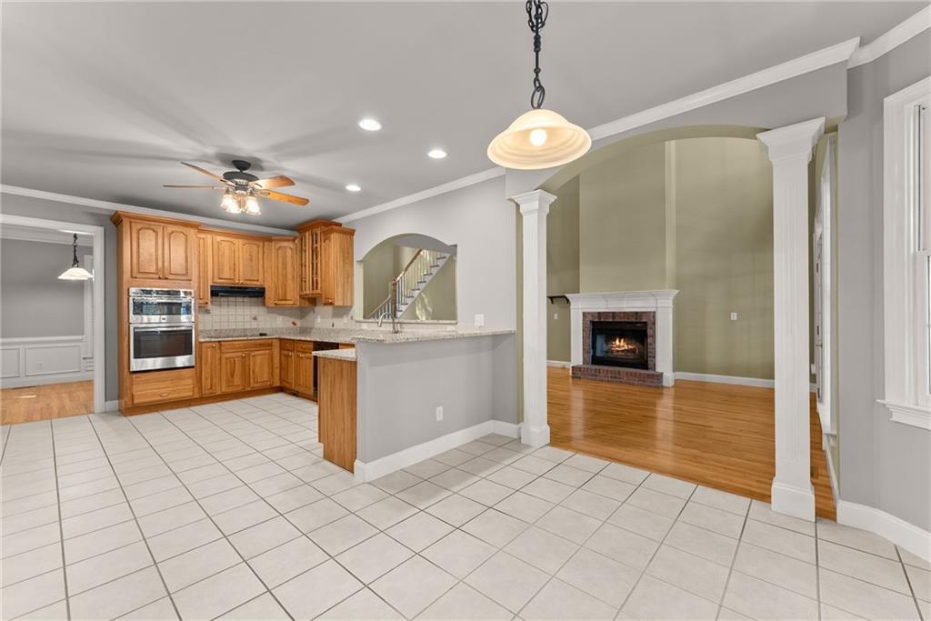 1040 Auburn Road Dacula, GA 30019 - Photo 18 of 42 a kitchen with stainless steel appliances granite countertop a refrigerator and a sink