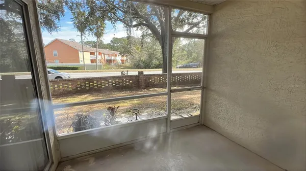 a view of a glass door and a yard