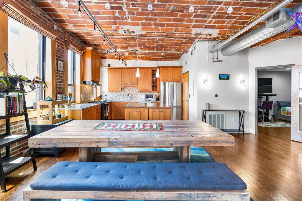 121-123 Beach Street, Unit 801 Boston, MA 02111 - Photo 2 of 28 a view of a hall with wooden floor