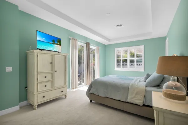 a bedroom with a bed and a couch