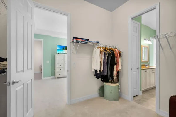 a bedroom with two beds and a night stand