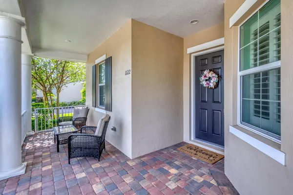 a living room with furniture and a gate