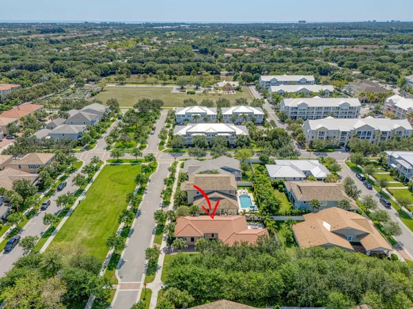 an aerial view of residential houses with outdoor space