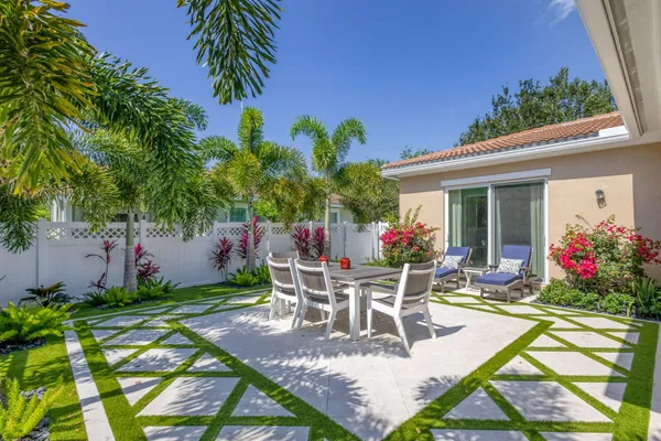 a view of a dining tables and chairs in patio of the house