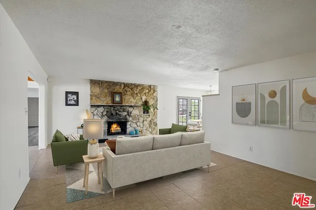 a view of a livingroom with wooden floor and a couch