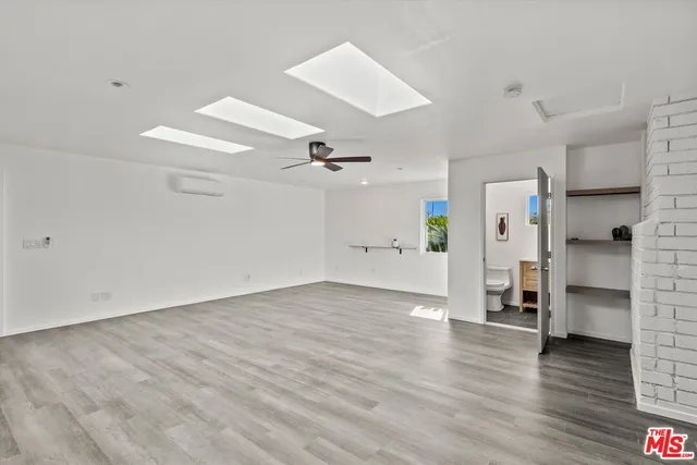 a bathroom with a sink mirror and toilet