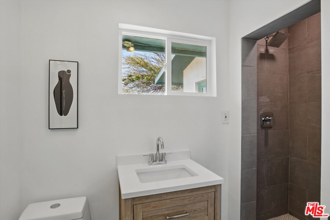 6391 Ruth Drive Yucca Valley, CA 92284 - Photo 19 of 56 a bathroom with a sink mirror and toilet