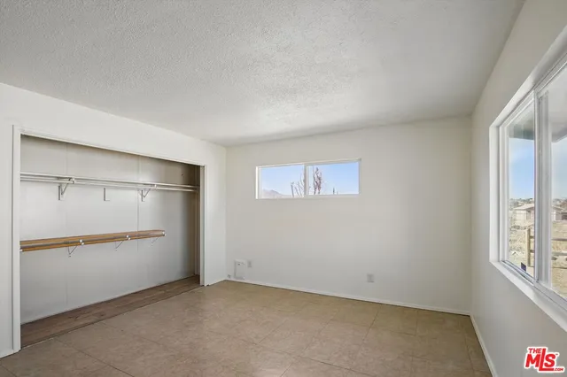 a view of room with windows and bathroom view