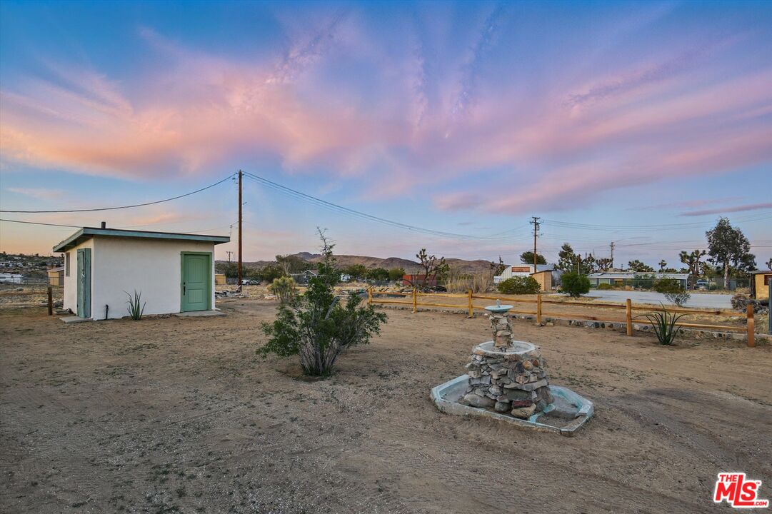 6391 Ruth Drive Yucca Valley, CA 92284 - Photo 34 of 56 a backyard of a house with a table and chairs