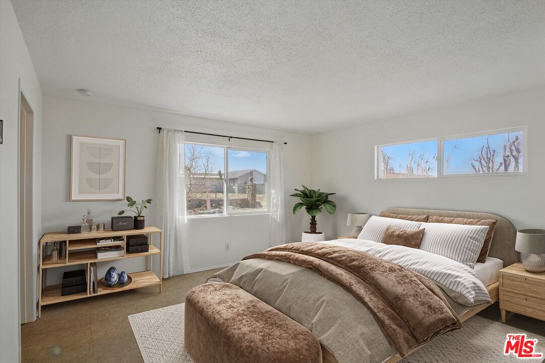 6391 Ruth Drive Yucca Valley, CA 92284 - Photo 6 of 56 a bedroom with a bed and a window