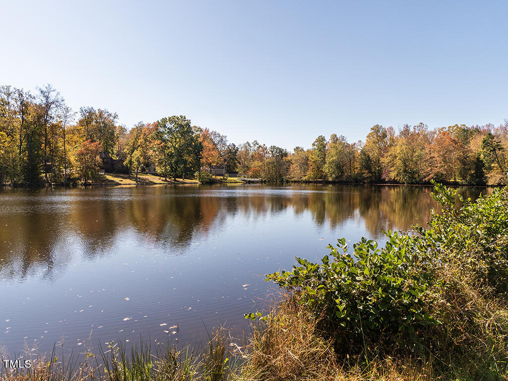 0 Bob Vaughn Road Graham, NC 27253 - Photo 15 of 31 a view of a lake with houses in the back