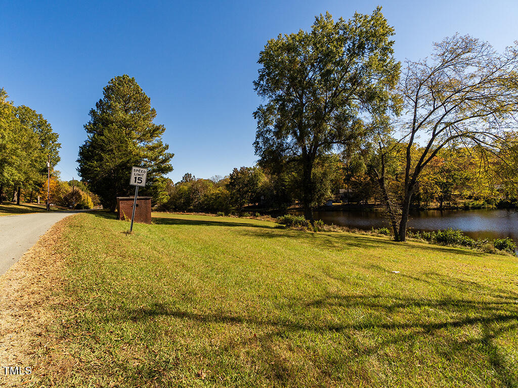 0 Bob Vaughn Road Graham, NC 27253 - Photo 7 of 31 a view of a swimming pool with an outdoor space and seating area