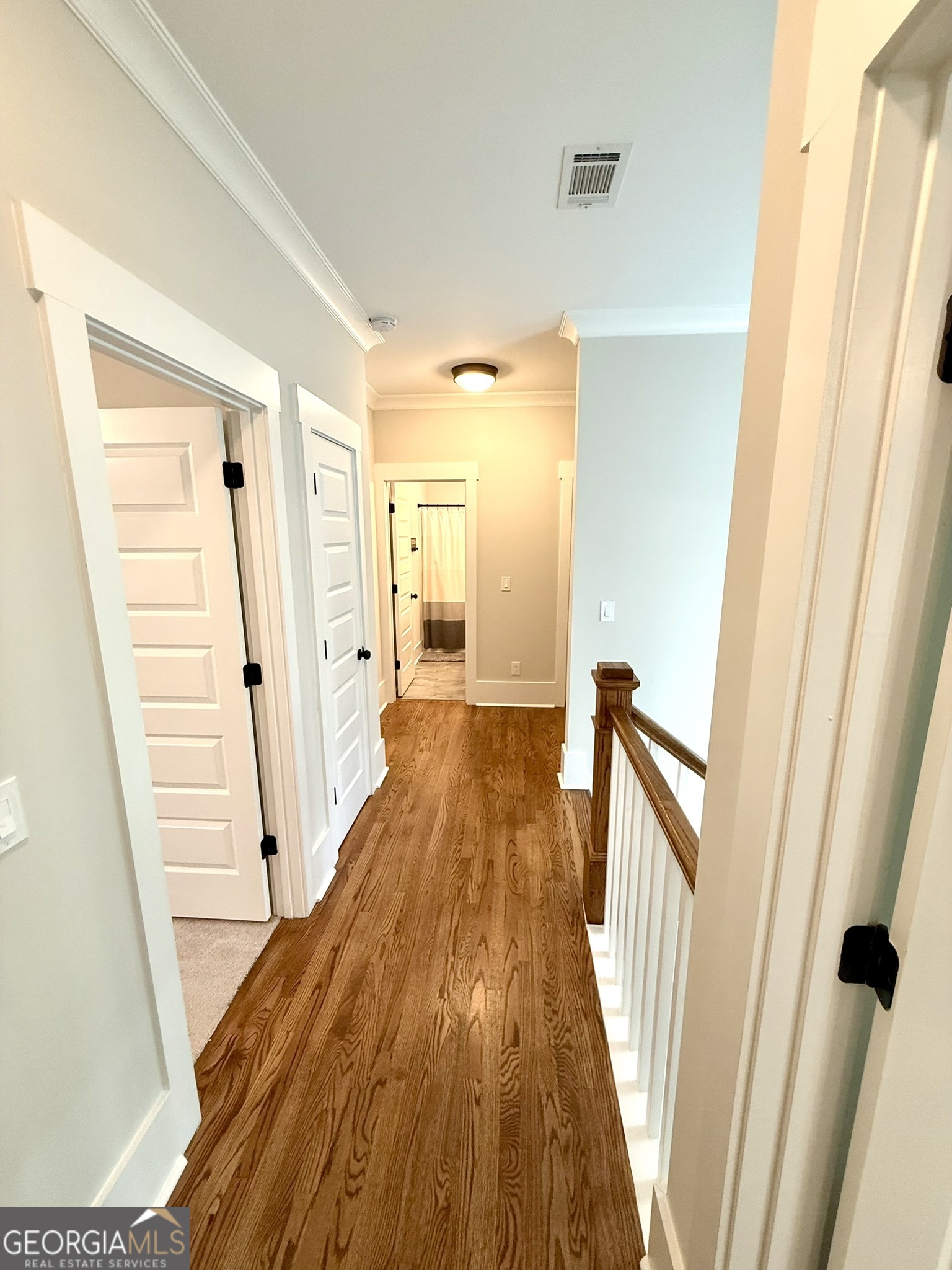 120 Spring Creek Drive Rutledge, GA 30663 - Photo 27 of 38 a view of a hallway with wooden floor and staircase