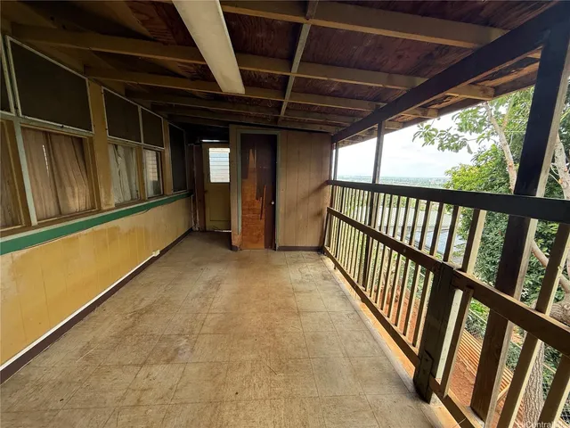 a side view of a house with a balcony