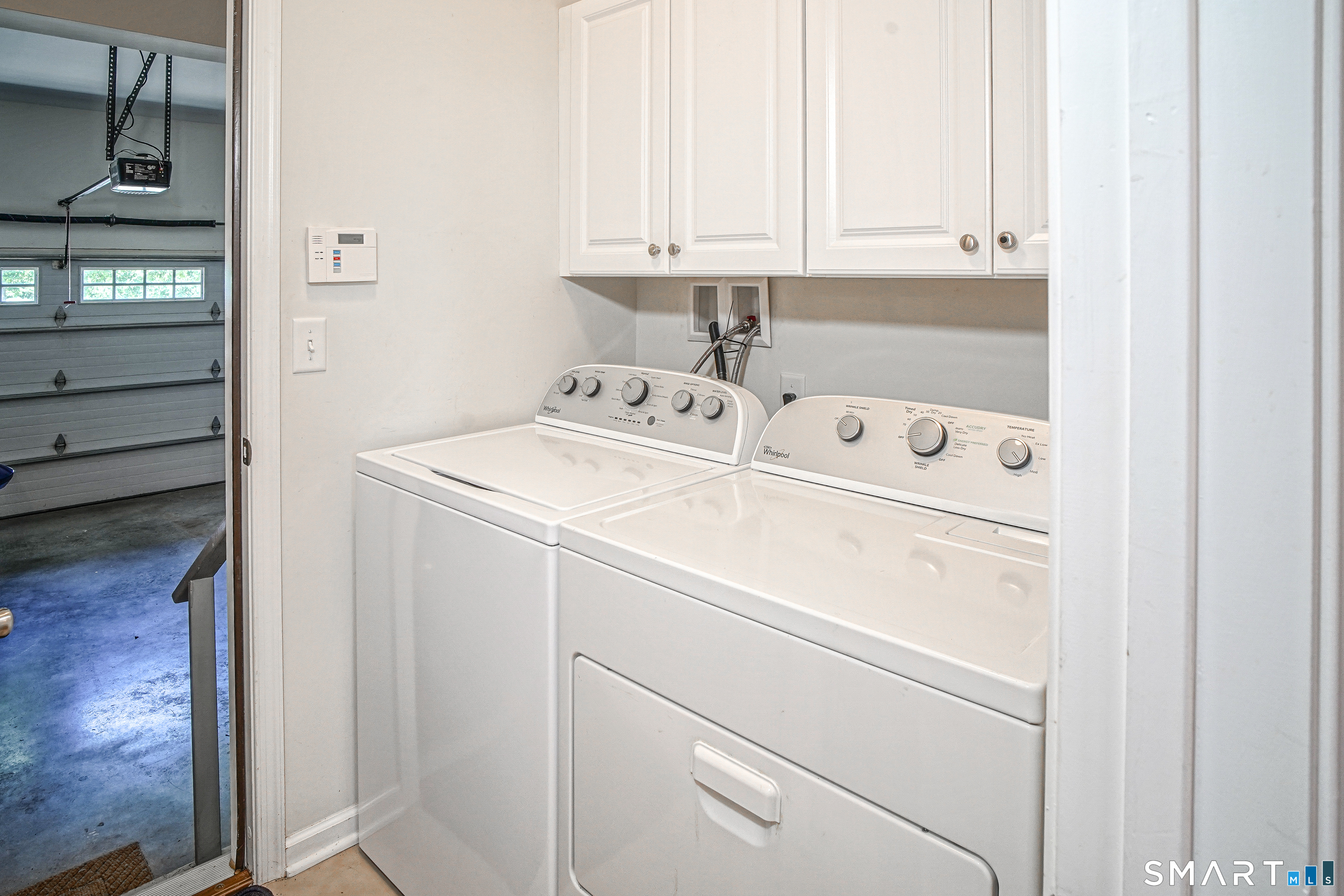 6 Lilac Lane, Unit 6 Prospect, CT 06712 - Photo 11 of 40 Washer and dryer with additional cabinets in the laundry room, which is located between the kitchen and garage.