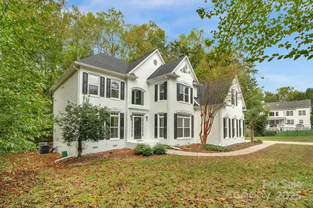 a house with trees in the background