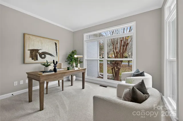 a living room with furniture and a lamp