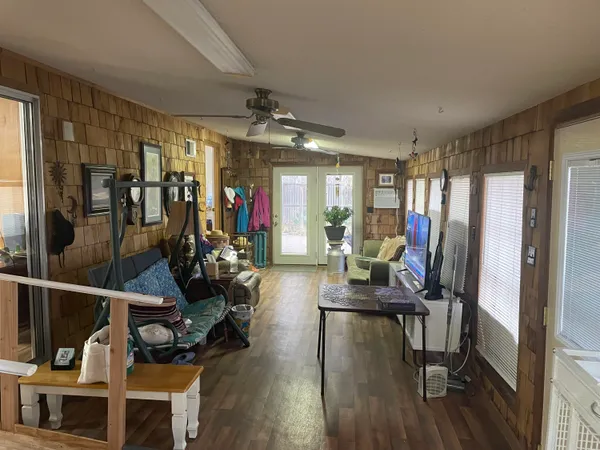 a bedroom with furniture and a mirror