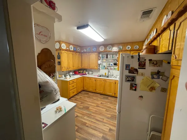 a bedroom with a bed and a mirror