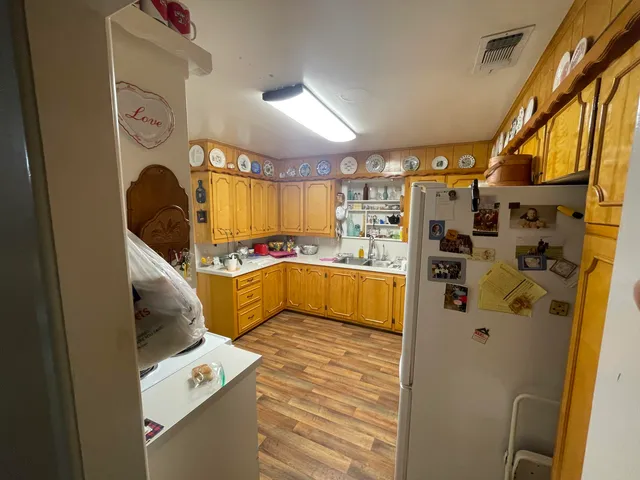 a bedroom with a bed and a mirror