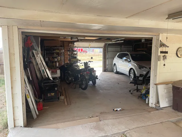 a view of a chairs and table in the patio