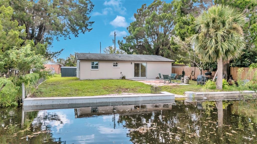 14832 Atlantic Avenue Hudson, FL 34667 - Photo 21 of 37 a view of house with swimming pool outdoor seating