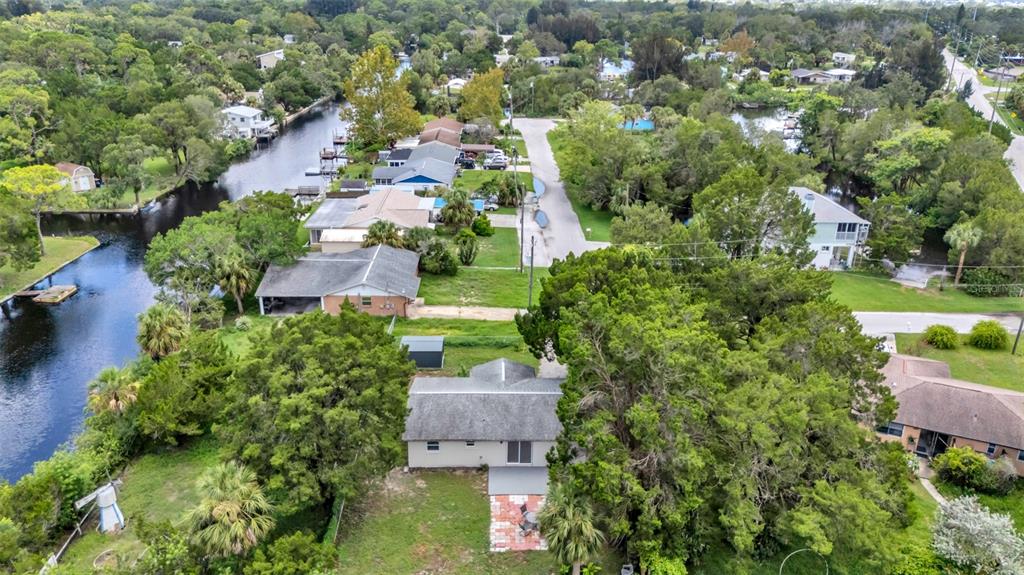 14832 Atlantic Avenue Hudson, FL 34667 - Photo 23 of 37 an aerial view of a house with a yard