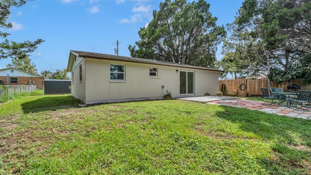 14832 Atlantic Avenue Hudson, FL 34667 - Photo 25 of 37 a view of an house with backyard space and garden