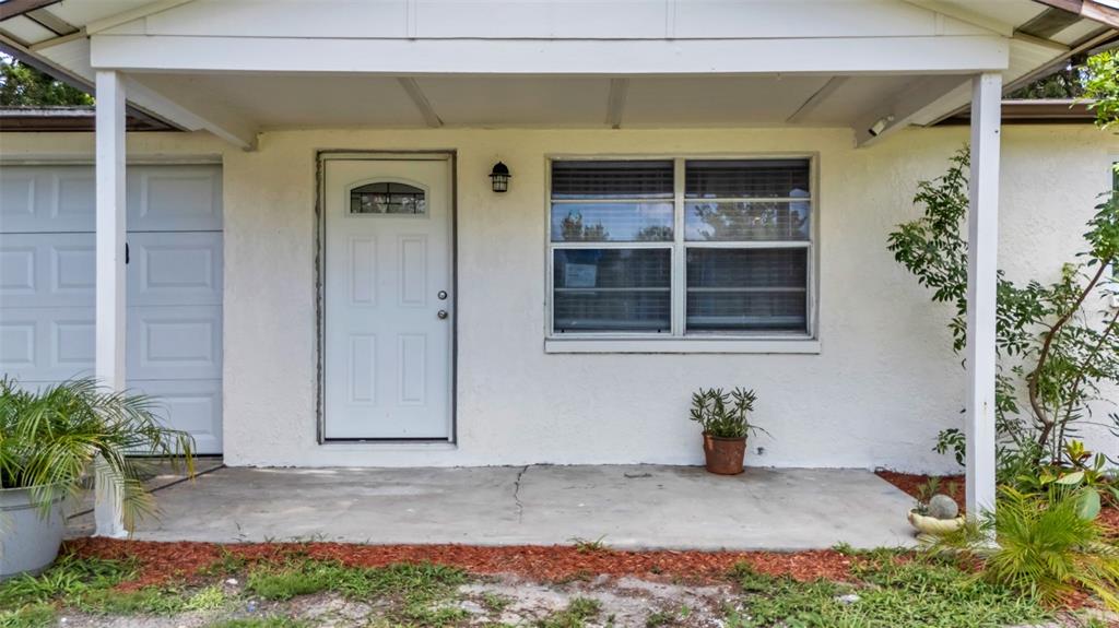 14832 Atlantic Avenue Hudson, FL 34667 - Photo 8 of 37 a view of front door of house