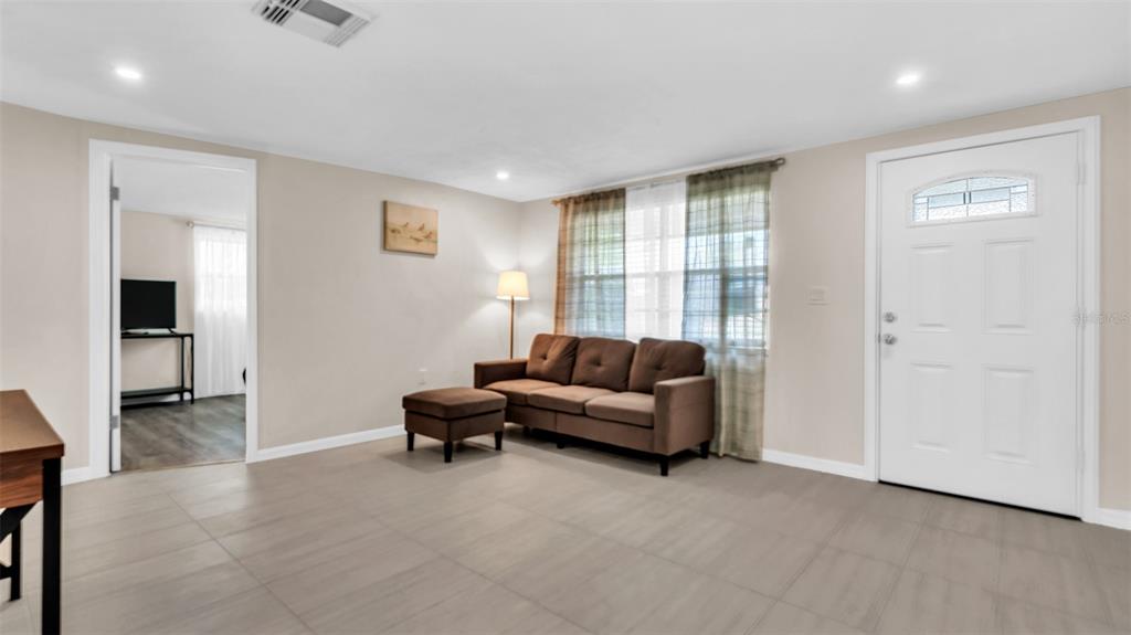 14832 Atlantic Avenue Hudson, FL 34667 - Photo 9 of 37 a living room with furniture and a window