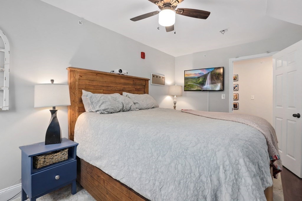 114 Waverly Street, Unit 3 Everett, MA 02149 - Photo 11 of 18 a bedroom with a bed and a tv