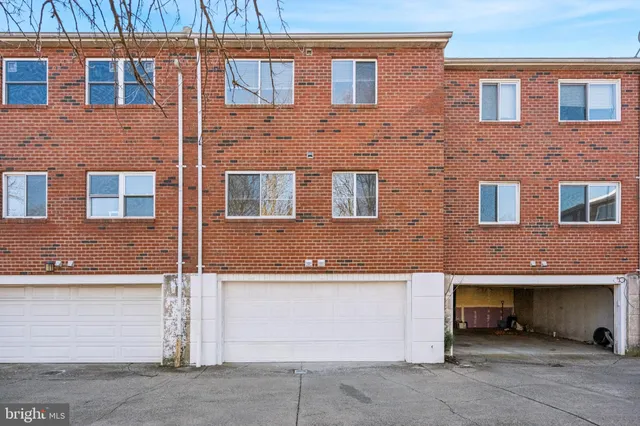 a front view of a building with many windows
