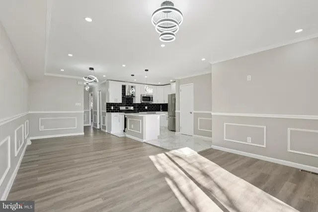 a view of kitchen with wooden floor