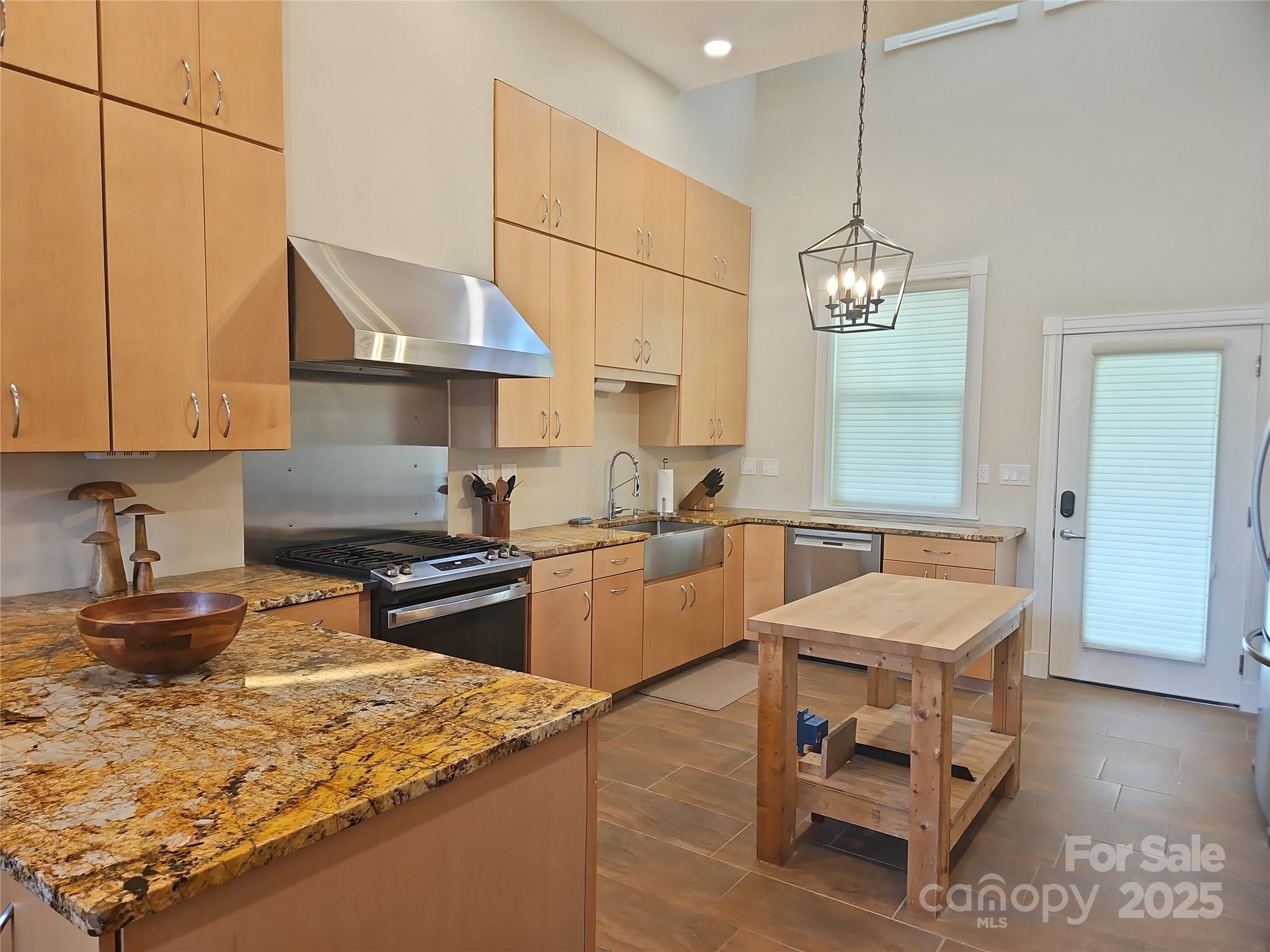 2905 Medlin Road Monroe, NC 28112 - Photo 13 of 39 a kitchen with a stove and a refrigerator