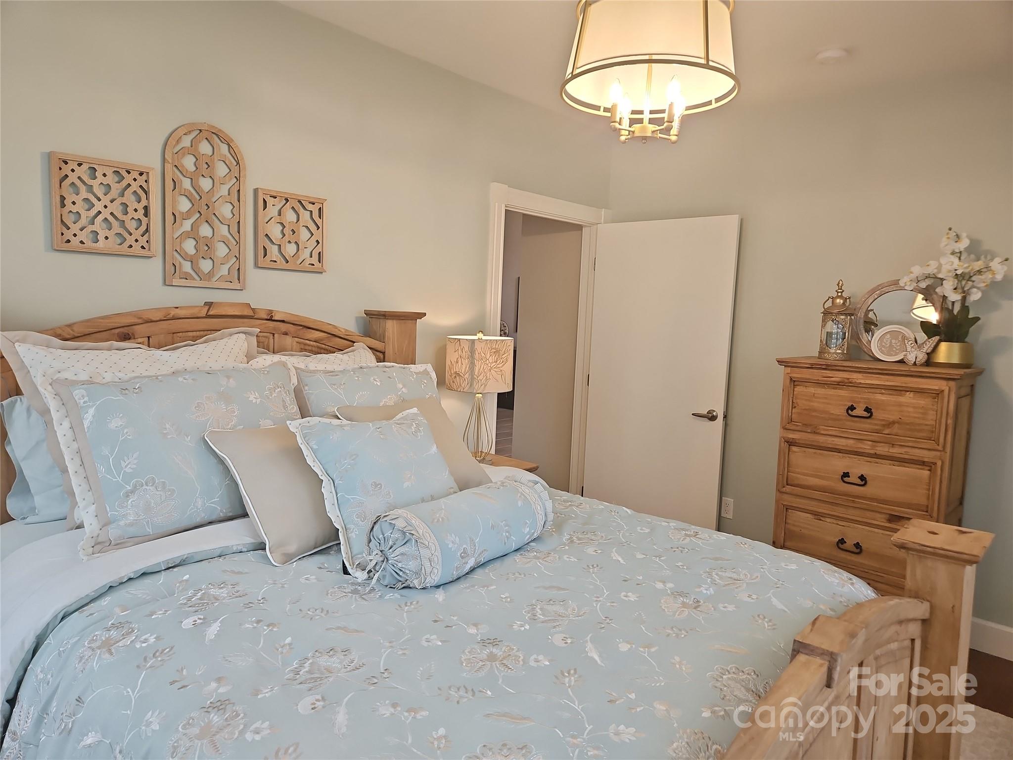 2905 Medlin Road Monroe, NC 28112 - Photo 20 of 39 a bedroom with a bed and a closet