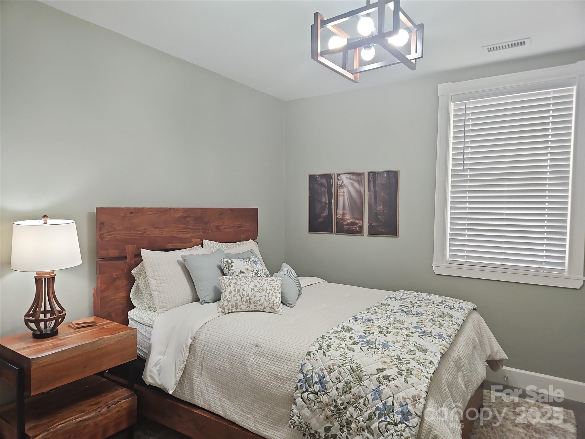 2905 Medlin Road Monroe, NC 28112 - Photo 23 of 39 a bedroom with a bed and a window