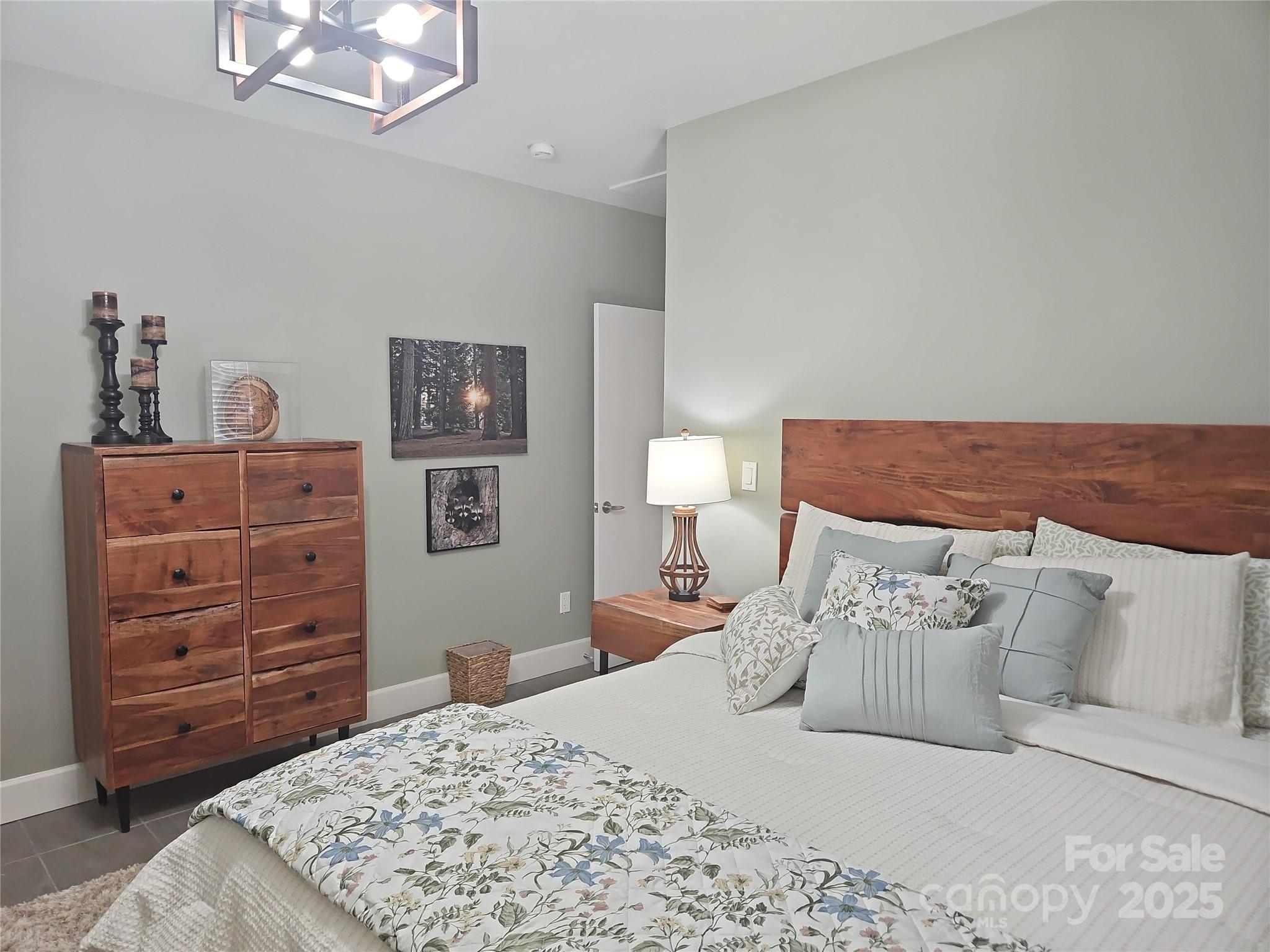 2905 Medlin Road Monroe, NC 28112 - Photo 24 of 39 a bed room with a bed and a dresser