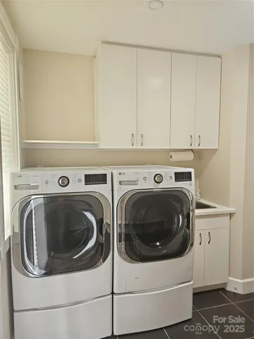 a kitchen with a sink a stove and cabinets