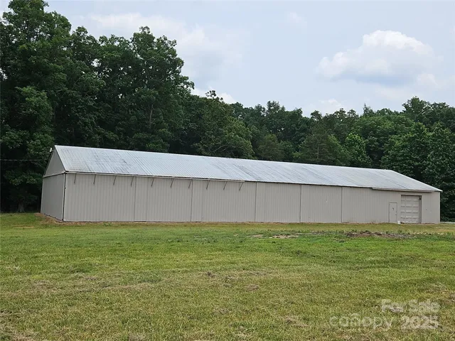 a view of a field with an trees