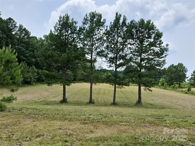 a view of a roof deck with wooden floor and fence