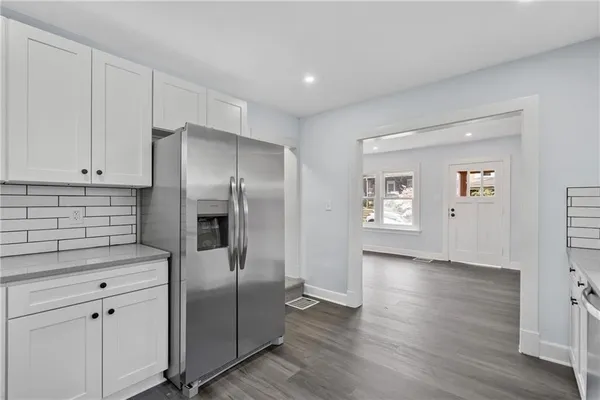 a bathroom with a shower and sink