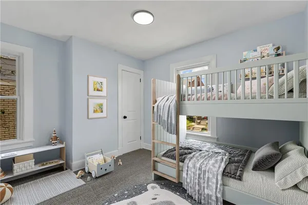 an empty room with windows and closet