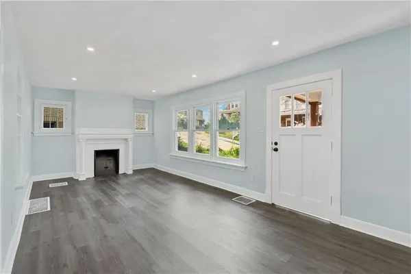a view of a kitchen with a sink and a fireplace